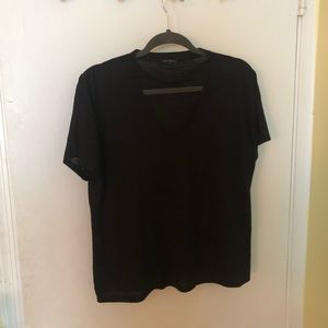 Simple black T-shirt with neckline cut out.